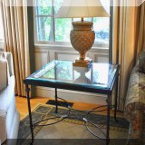 F27. Metal and glass side table. 26&rdquo;h x 28&rdquo;w x 24&rdquo;d 